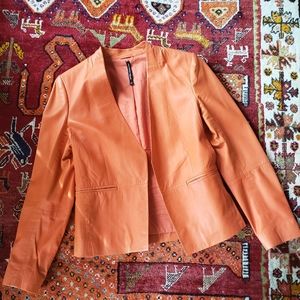 A lightweight leather open front blazer